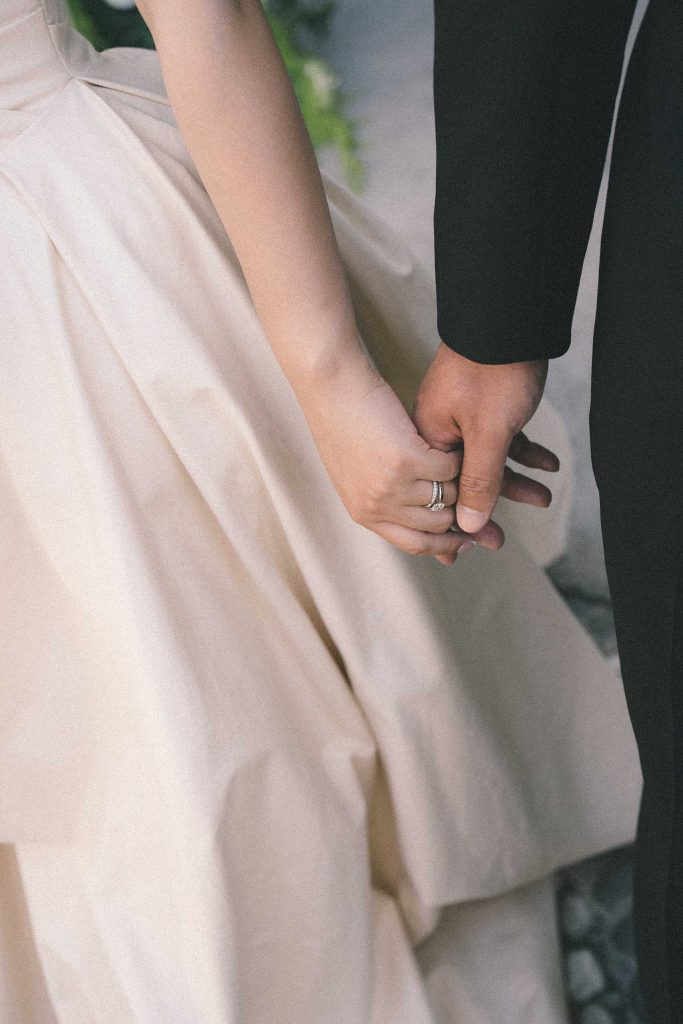 Skye & Vincent sharing a candid hand-in-hand moment