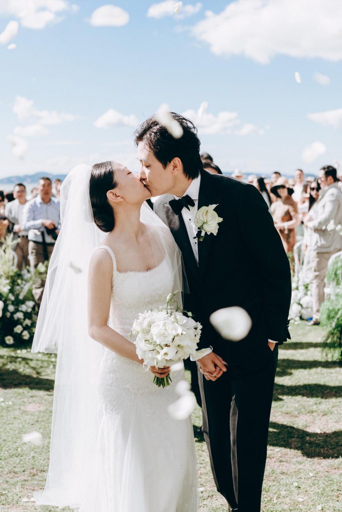 Kimber & Gavin's kiss during their ceremony recessional